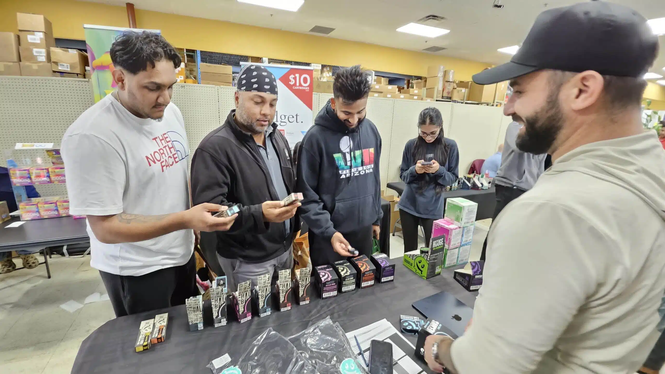 Attendees testing products at a table