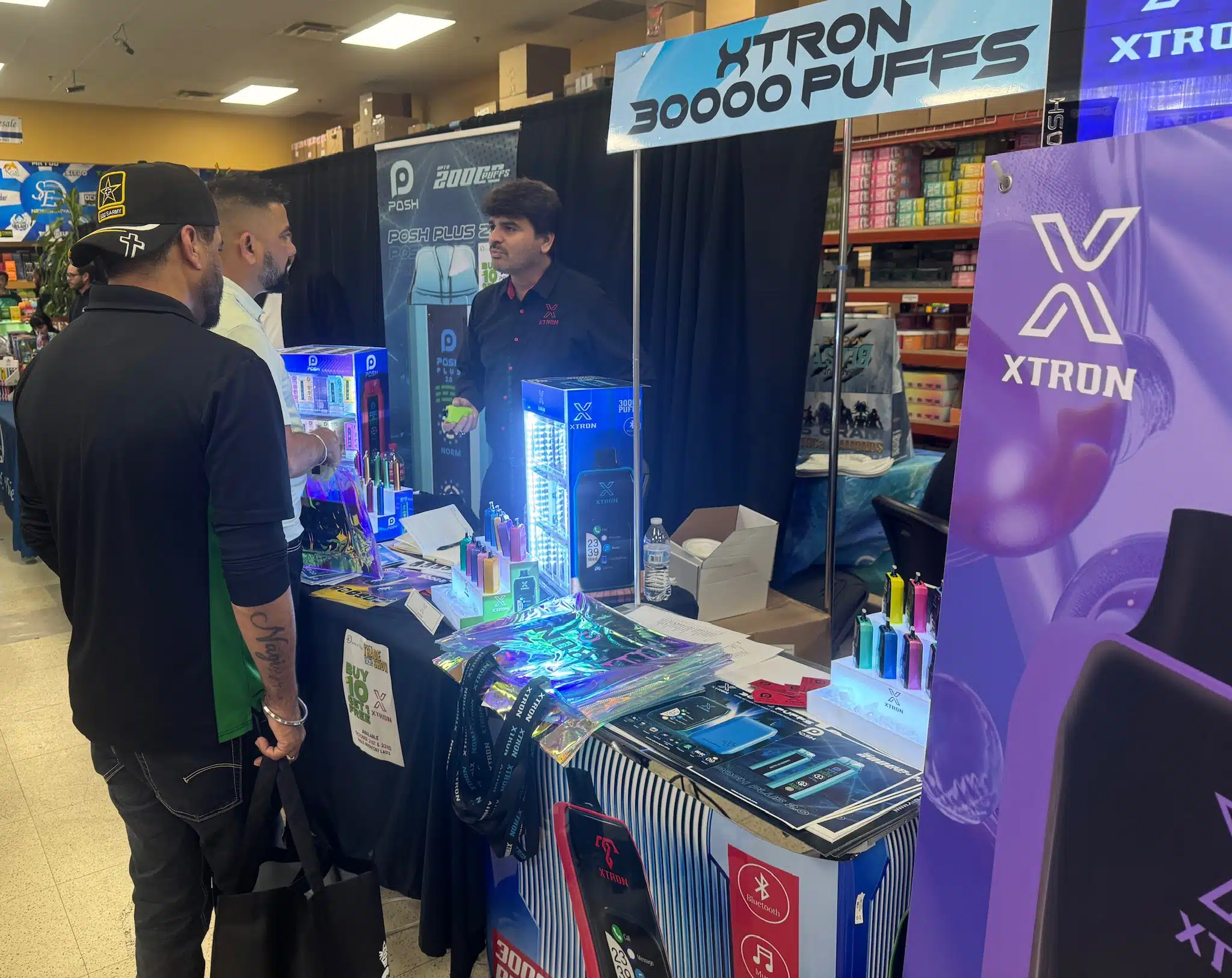 Xtron booth with products and visitors